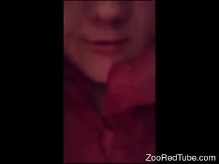 Young girl makes a blowjob to her dog's cock